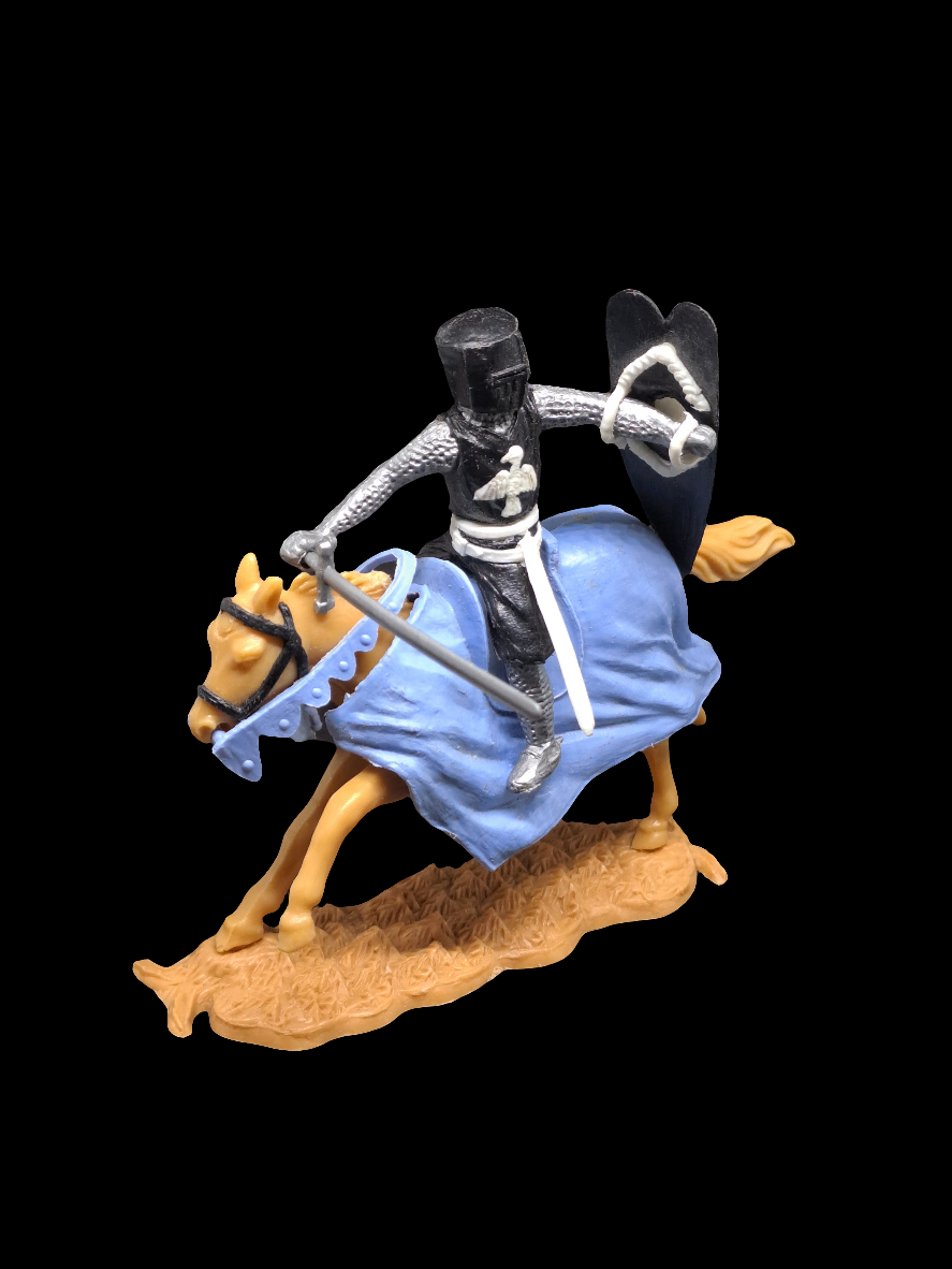 Knight on horse with sword and shield.