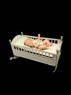 Doll in bed
