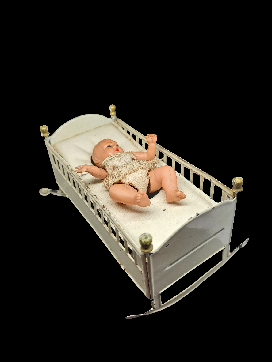 Doll in bed