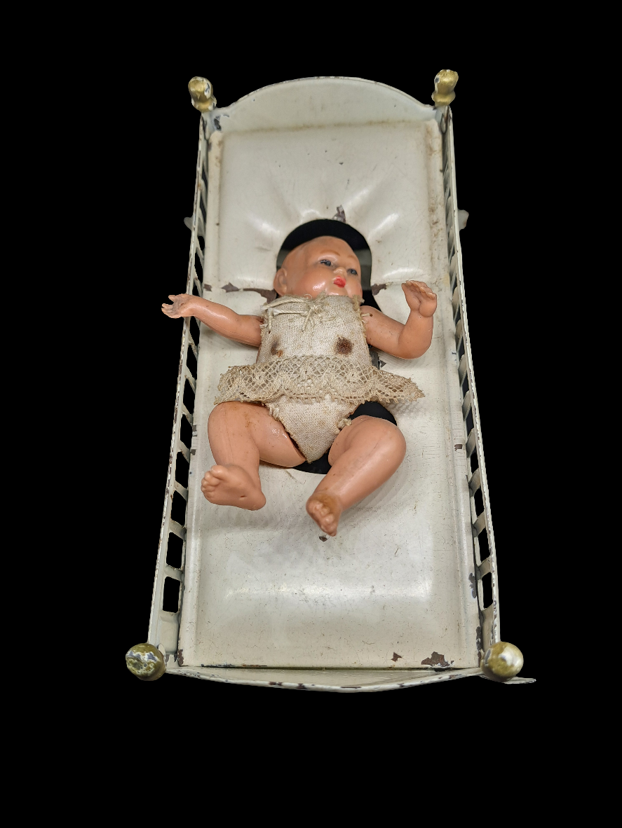Doll in bed
