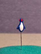Needle. Bird.